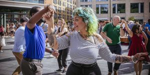 Couple dancing outside at Spitalfields